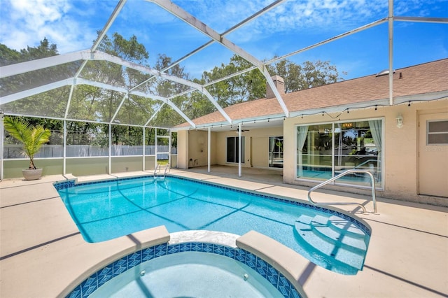 11291 Countrywood Ct, Spring Hill, FL 34609 - view of swimming pool featuring a patio area, a pool with connected hot tub, a lanai, and a ceiling fan