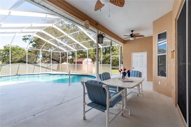 5423 Abagail Dr, Spring Hill, FL 34608 - view of pool with a ceiling fan, a patio, glass enclosure, and a storage shed