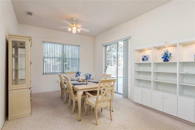 5423 Abagail Dr, Spring Hill, FL 34608 - dining space featuring light carpet and ceiling fan