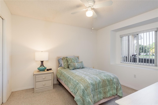 5423 Abagail Dr, Spring Hill, FL 34608 - bedroom featuring light colored carpet, ceiling fan, and a textured ceiling