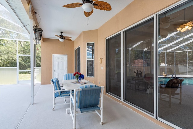 5423 Abagail Dr, Spring Hill, FL 34608 - view of patio / terrace featuring ceiling fan, glass enclosure, and outdoor dining area