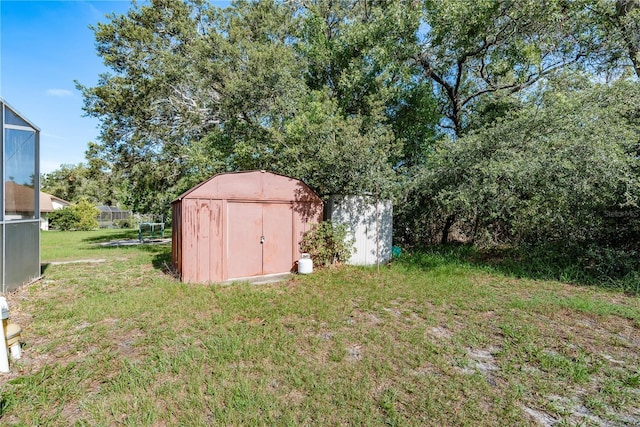 5423 Abagail Dr, Spring Hill, FL 34608 - view of grassy yard featuring a storage unit