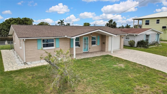 12637 2nd Isle, Hudson, FL 34667 - ranch-style house featuring driveway, roof with shingles, and a garage