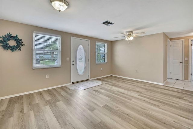 12637 2nd Isle, Hudson, FL 34667 - entrance foyer with ceiling fan, light wood-style floors, and baseboards
