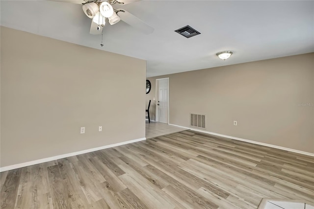12637 2nd Isle, Hudson, FL 34667 - empty room with a ceiling fan, light wood-style flooring, and baseboards