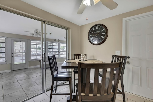12637 2nd Isle, Hudson, FL 34667 - dining area featuring ceiling fan, light tile patterned flooring, and baseboards