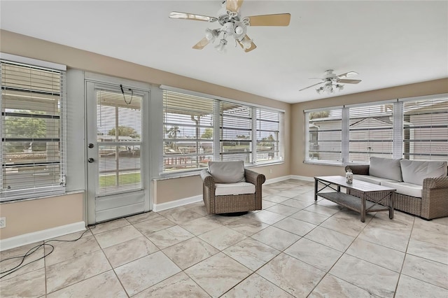 12637 2nd Isle, Hudson, FL 34667 - sunroom with baseboards and tile patterned flooring