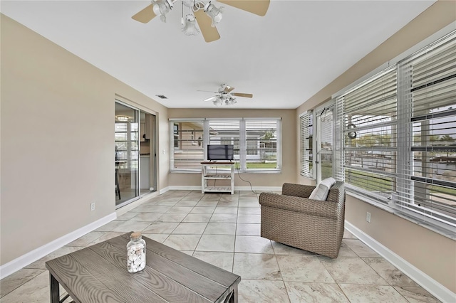 12637 2nd Isle, Hudson, FL 34667 - sunroom featuring baseboards and tile patterned floors