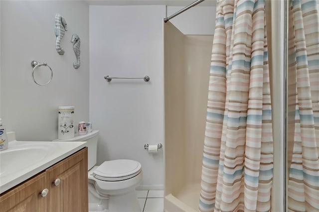 12637 2nd Isle, Hudson, FL 34667 - bathroom with tile patterned floors, a shower with curtain, vanity, and toilet
