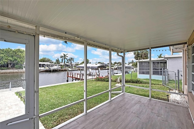 12637 2nd Isle, Hudson, FL 34667 - unfurnished sunroom featuring a water view
