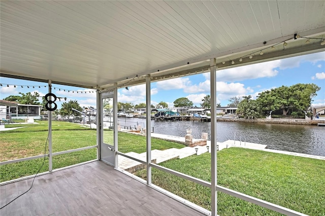 12637 2nd Isle, Hudson, FL 34667 - unfurnished sunroom featuring a water view and healthy amount of natural light