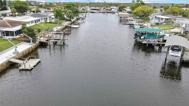 12637 2nd Isle, Hudson, FL 34667 - dock area featuring boat lift, a water view, and a residential view