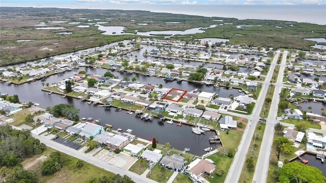 12637 2nd Isle, Hudson, FL 34667 - aerial perspective of suburban area with a large body of water