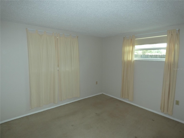 7421 Fairfax Dr, Port Richey, FL 34668 - carpeted spare room with a textured ceiling