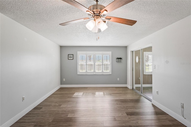 9622 Brassie Ct Unit 9, New Port Richey, FL 34655 - spare room featuring plenty of natural light, a textured ceiling, ceiling fan, wood finished floors, and baseboards