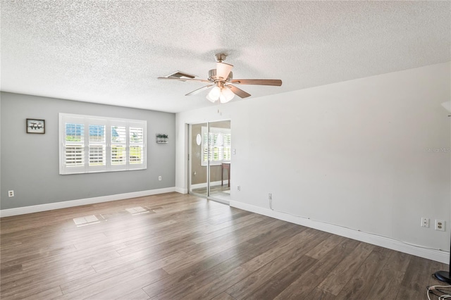 9622 Brassie Ct Unit 9, New Port Richey, FL 34655 - empty room with ceiling fan, wood finished floors, a textured ceiling, and baseboards