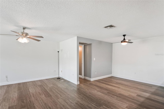 9622 Brassie Ct Unit 9, New Port Richey, FL 34655 - spare room featuring ceiling fan, wood finished floors, a textured ceiling, and baseboards