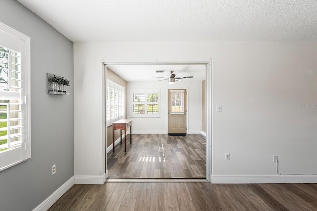 9622 Brassie Ct Unit 9, New Port Richey, FL 34655 - entrance foyer featuring wood finished floors, ceiling fan, and baseboards
