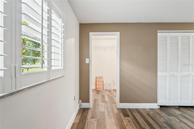9622 Brassie Ct Unit 9, New Port Richey, FL 34655 - unfurnished bedroom featuring wood finished floors and baseboards
