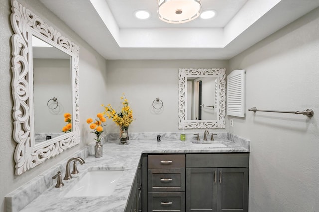9622 Brassie Ct Unit 9, New Port Richey, FL 34655 - bathroom with double vanity and a raised ceiling