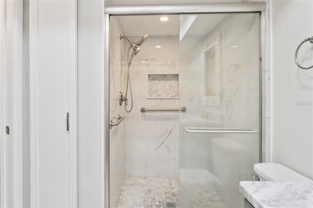 9622 Brassie Ct Unit 9, New Port Richey, FL 34655 - bathroom with a marble finish shower, vanity, toilet, and recessed lighting