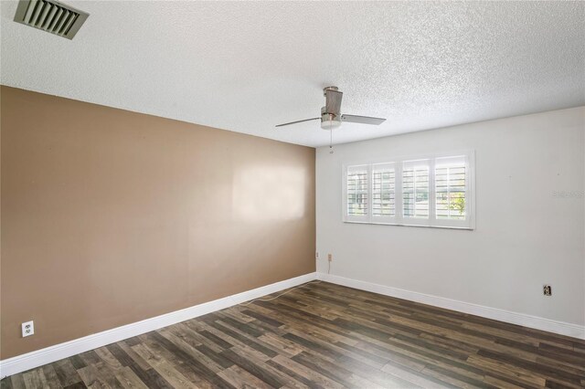 9622 Brassie Ct Unit 9, New Port Richey, FL 34655 - empty room featuring a ceiling fan, dark wood-type flooring, a textured ceiling, and baseboards
