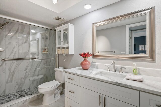 9622 Brassie Ct Unit 9, New Port Richey, FL 34655 - bathroom featuring toilet, vanity, a marble finish shower, and recessed lighting