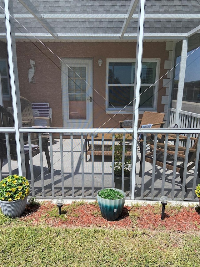 9622 Brassie Ct Unit 9, New Port Richey, FL 34655 - doorway to property featuring roof with shingles
