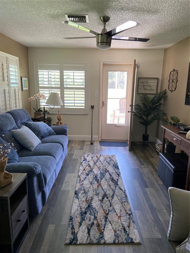 9622 Brassie Ct Unit 9, New Port Richey, FL 34655 - living area with a ceiling fan, wood finished floors, a textured ceiling, and baseboards