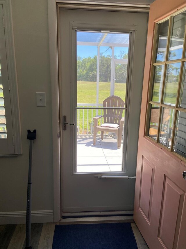 9622 Brassie Ct Unit 9, New Port Richey, FL 34655 - doorway featuring baseboards and wood finished floors