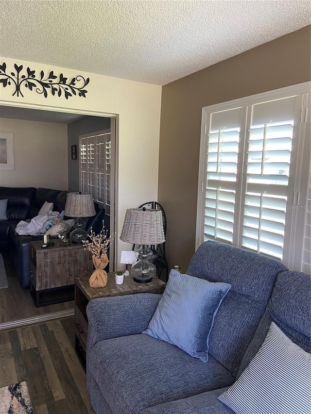 9622 Brassie Ct Unit 9, New Port Richey, FL 34655 - bedroom with wood finished floors and a textured ceiling