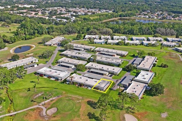 9622 Brassie Ct Unit 9, New Port Richey, FL 34655 - aerial view of property and surrounding area with a large body of water, nearby suburban area, a golf course, and a tree filled landscape
