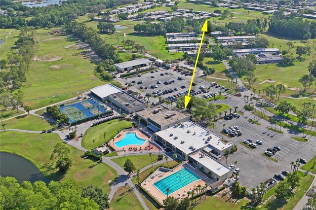 9622 Brassie Ct Unit 9, New Port Richey, FL 34655 - aerial overview of property's location featuring a pool, a large body of water, and a golf course