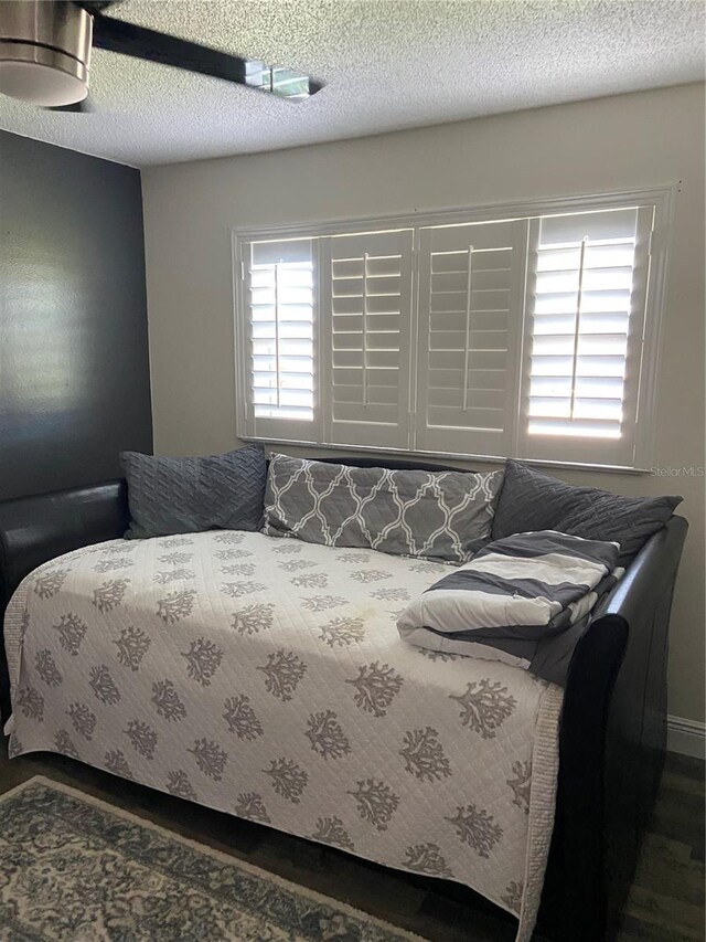 9622 Brassie Ct Unit 9, New Port Richey, FL 34655 - bedroom featuring a ceiling fan and wood finished floors
