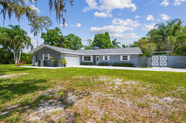 10301 Nina Ct, New Port Richey, FL 34654 - single story home featuring central AC unit, a garage, driveway, and stucco siding