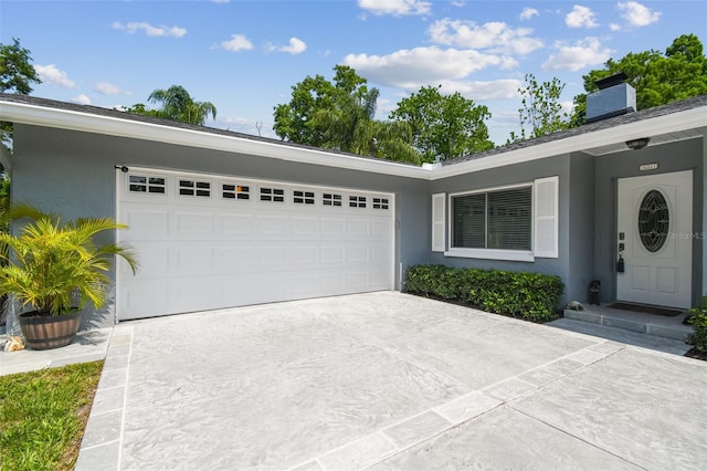 10301 Nina Ct, New Port Richey, FL 34654 - ranch-style house featuring concrete driveway, stucco siding, and an attached garage