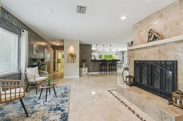 10301 Nina Ct, New Port Richey, FL 34654 - living area with recessed lighting, a textured ceiling, and a fireplace