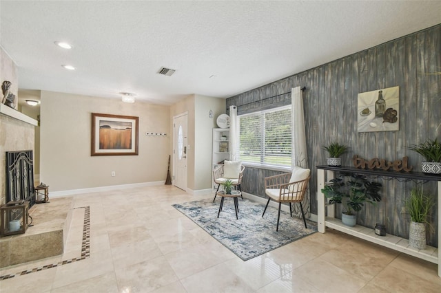 10301 Nina Ct, New Port Richey, FL 34654 - living area with baseboards, a textured ceiling, and recessed lighting