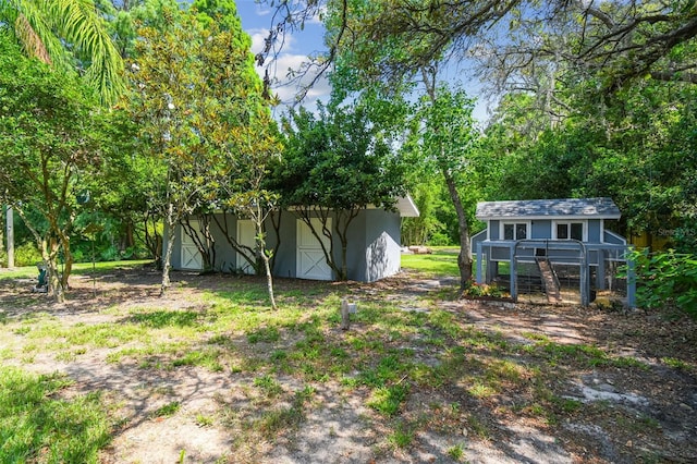 10301 Nina Ct, New Port Richey, FL 34654 - view of yard featuring an outbuilding and exterior structure