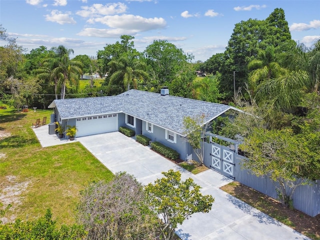 10301 Nina Ct, New Port Richey, FL 34654 - single story home with concrete driveway, a garage, stucco siding, and central AC unit