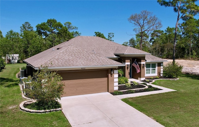 9152 Bunting Rd, Weeki Wachee, FL 34613 - view of front facade with a shingled roof, a garage, a front lawn, driveway, and stucco siding