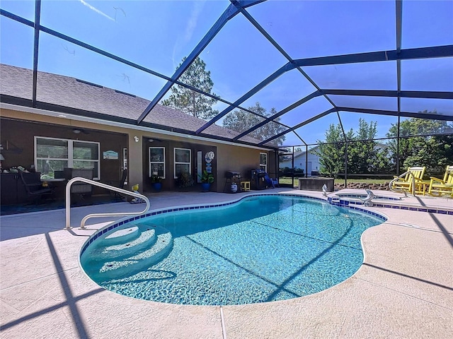 9152 Bunting Rd, Weeki Wachee, FL 34613 - view of pool with a patio, glass enclosure, and a pool with connected hot tub