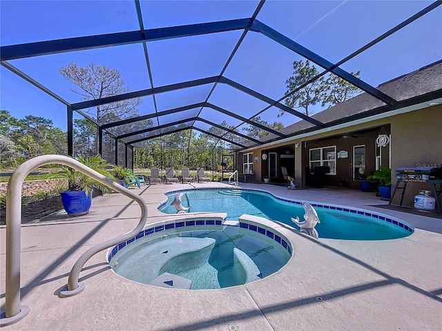 9152 Bunting Rd, Weeki Wachee, FL 34613 - view of swimming pool featuring a pool with connected hot tub, a patio, and glass enclosure