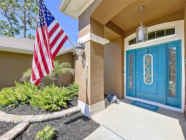 9152 Bunting Rd, Weeki Wachee, FL 34613 - doorway to property with stucco siding