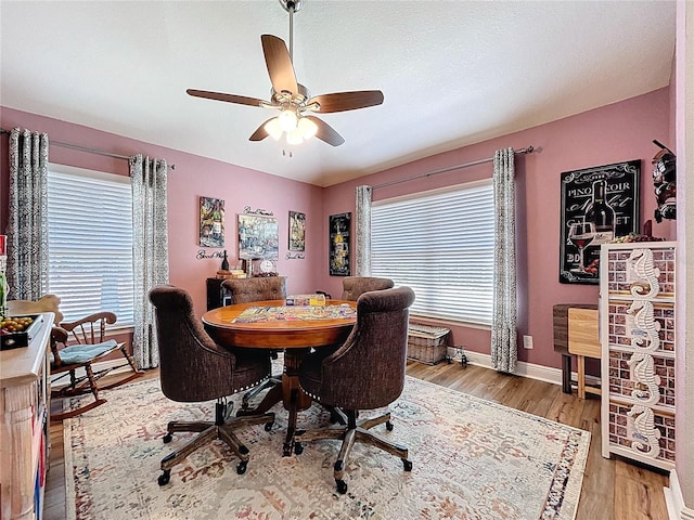 9152 Bunting Rd, Weeki Wachee, FL 34613 - office space featuring a ceiling fan, wood finished floors, and baseboards