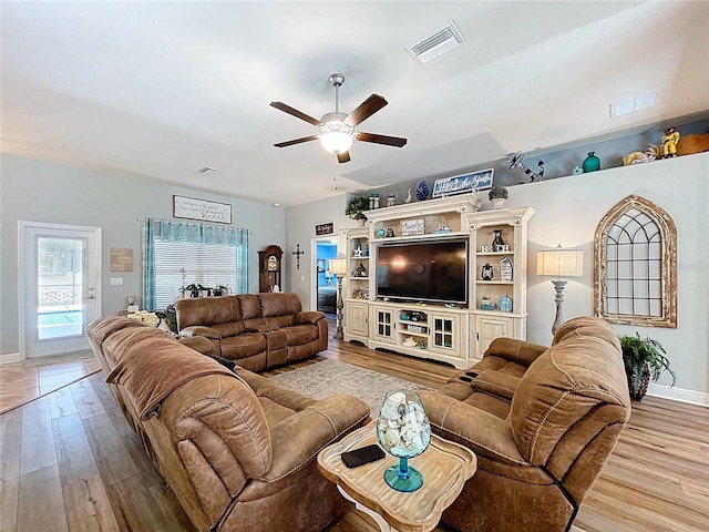9152 Bunting Rd, Weeki Wachee, FL 34613 - living room with a ceiling fan, wood finished floors, and baseboards