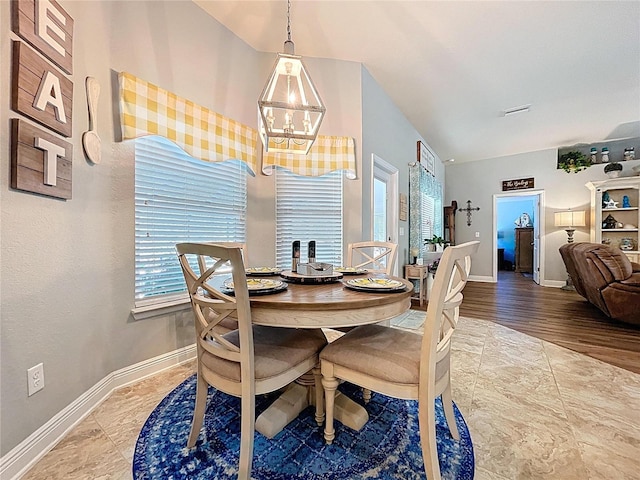 9152 Bunting Rd, Weeki Wachee, FL 34613 - dining room with a chandelier and baseboards