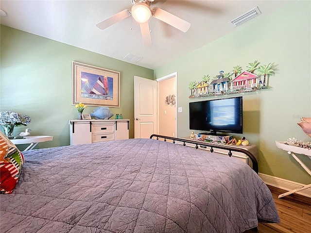 9152 Bunting Rd, Weeki Wachee, FL 34613 - bedroom featuring wood finished floors, baseboards, and ceiling fan