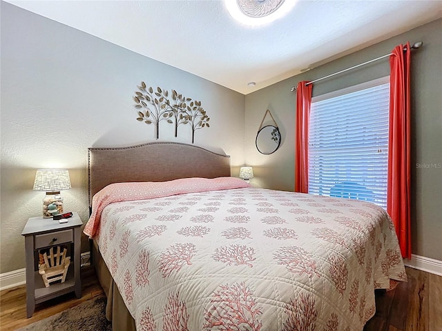 9152 Bunting Rd, Weeki Wachee, FL 34613 - bedroom with wood finished floors and baseboards