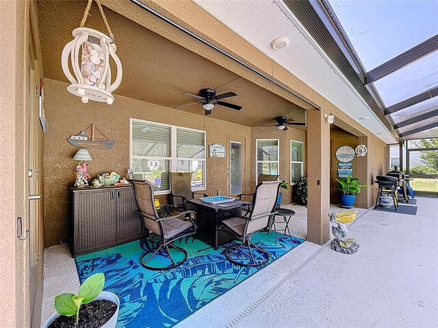 9152 Bunting Rd, Weeki Wachee, FL 34613 - view of patio featuring a ceiling fan and glass enclosure